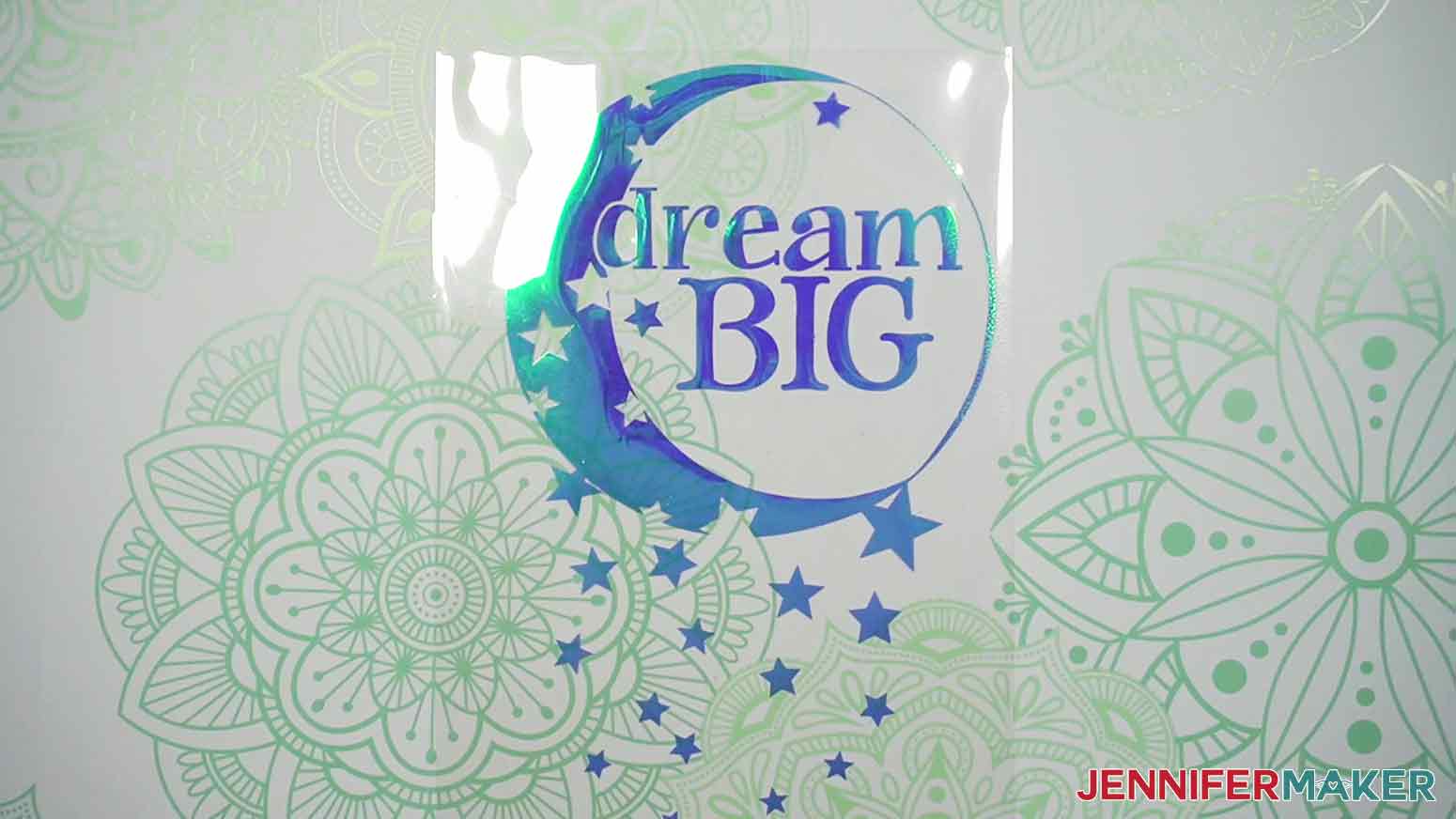 Here is the prepared Dream Big decal cut out of Cricut Holographic Iron-on vinyl, weeded, and ready to be placed on our shirt with our T-Shirt Ruler.