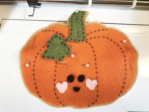 Pin layers in place for autumn felt ornament