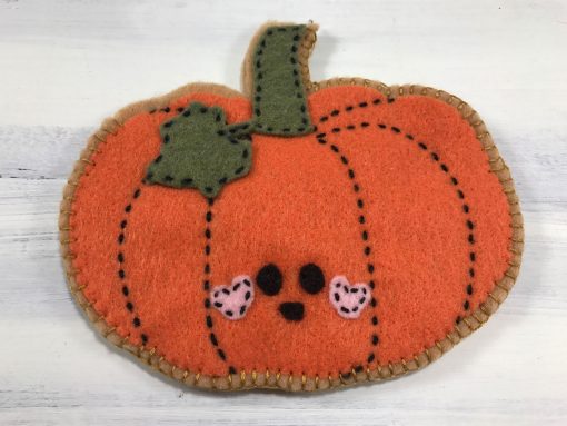 The felt pumpkin is sewed except for the last couple of inches