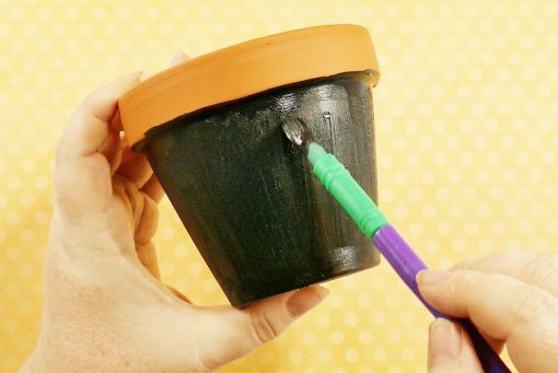 Paint a flower pot with chalkboard paint