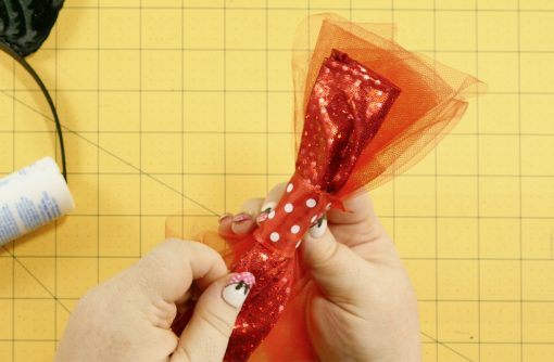 Wrap the ribbon around the bow and tulle on the DIY Mouse Ears