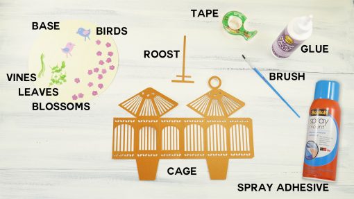 Materials to make a paper pop-up birdcage