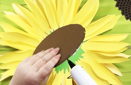 Gluing the cover onto the foam for the paper sunflower