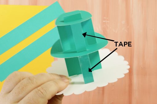 Put double-stick tape on the sides of your cake supoorts