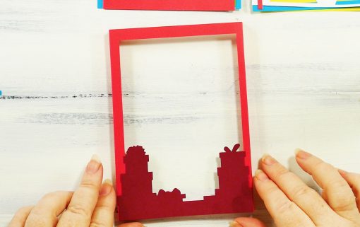 Glue the presents to the front of your shadow box frame