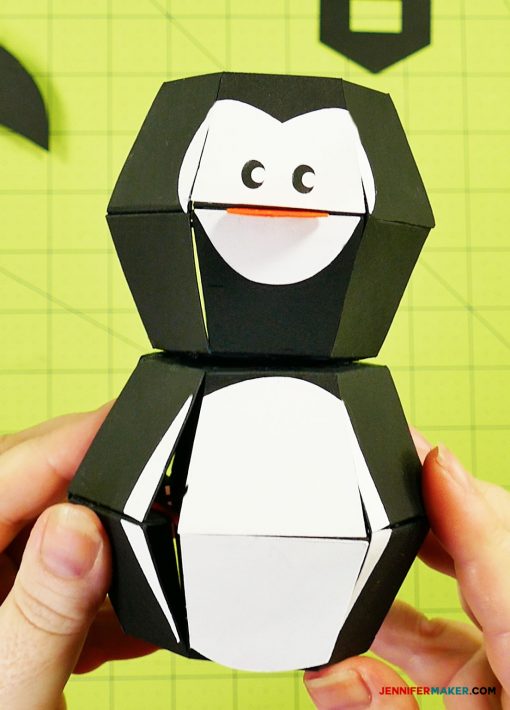 Gluing the head to the body of your penguin paper bomb