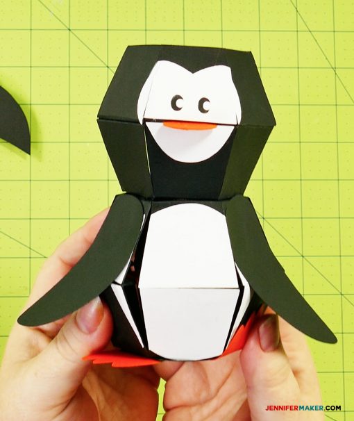 Glue the wings on your penguin paper bomb