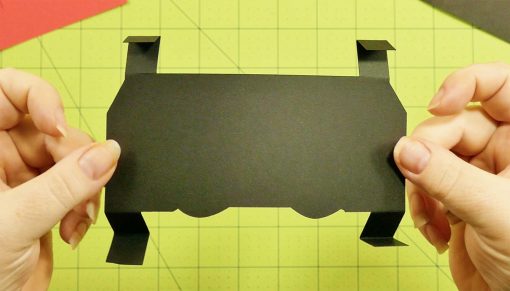 Fold the tabs on the black pop-up section for the popup game controller card