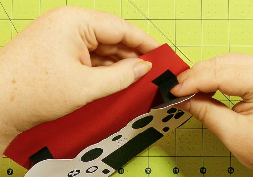 Insert the tabs into the slots for the pop-up game controller card