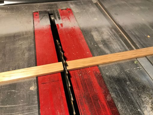 Cutting the shoe moulding strips to size on the table saw