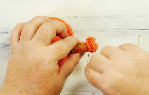 Wrap thread up the stem of your sweater pumpkin