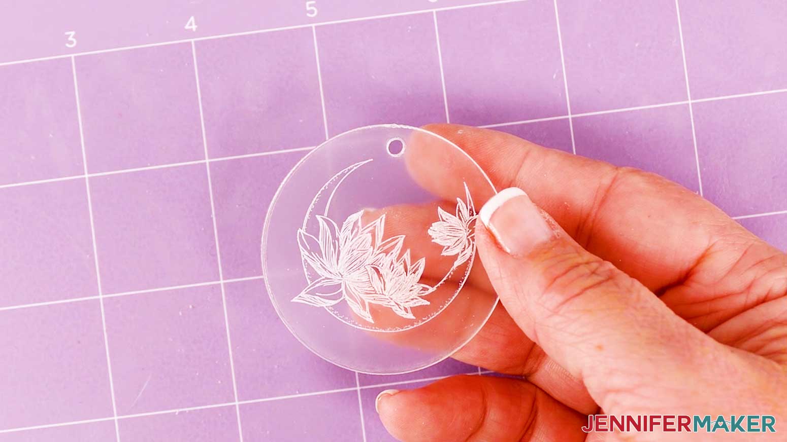 A picture of what the final engraved acrylic keychain looks like with the Moon Flower design.