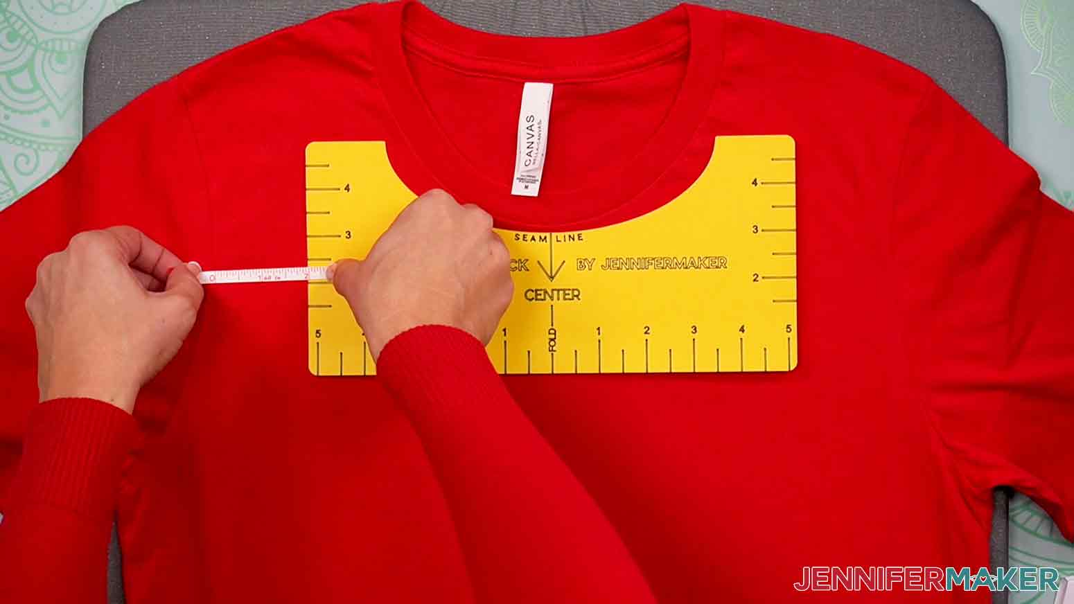 Use a measuring tape to measure the distance between the left seam of the sleeve and the left edge of the T-Shirt Ruler.