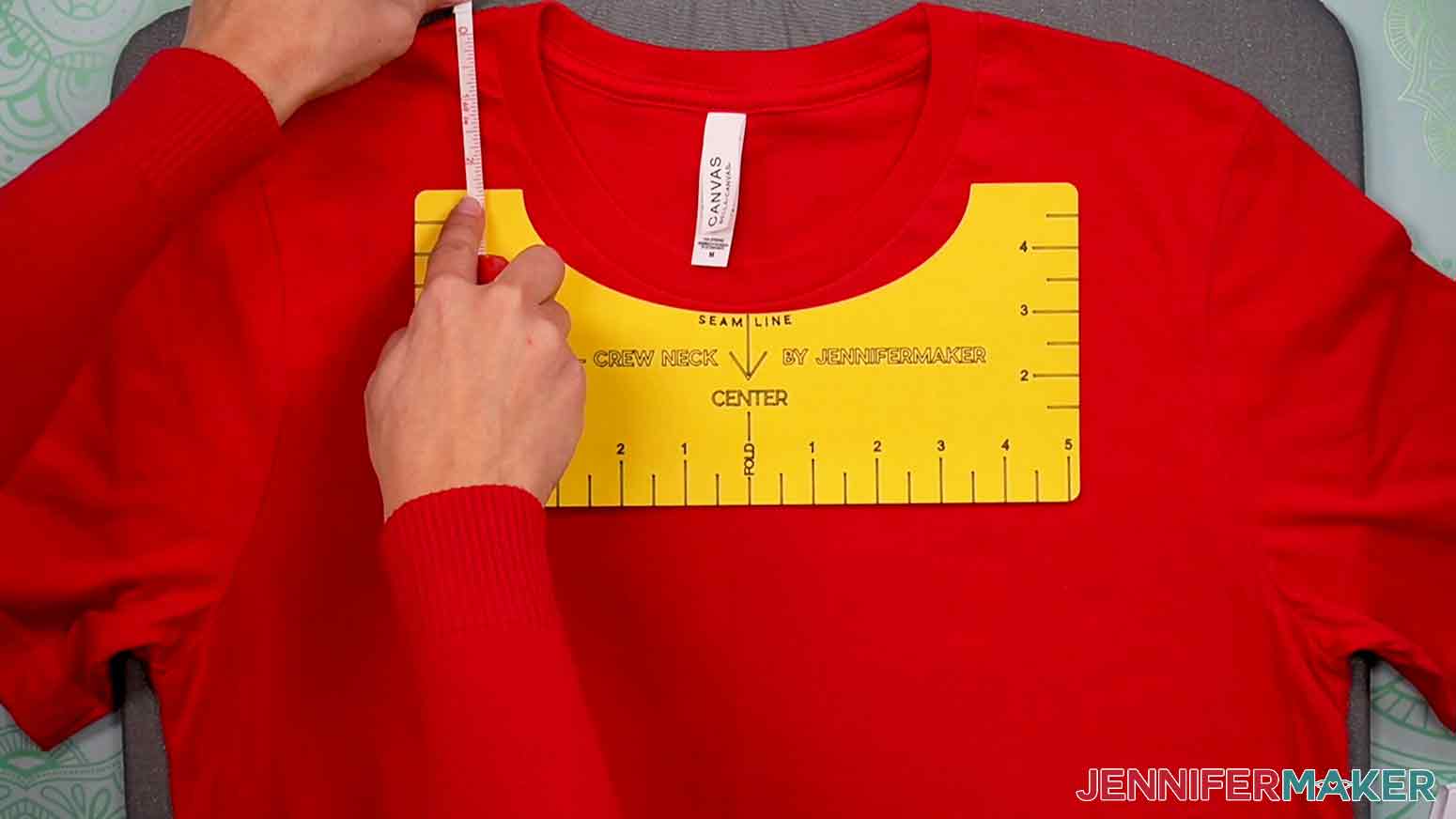 Use a measuring tape to measure the distance between the top left edge of the T-Shirt Ruler and the left shoulder seam of the t-shirt.