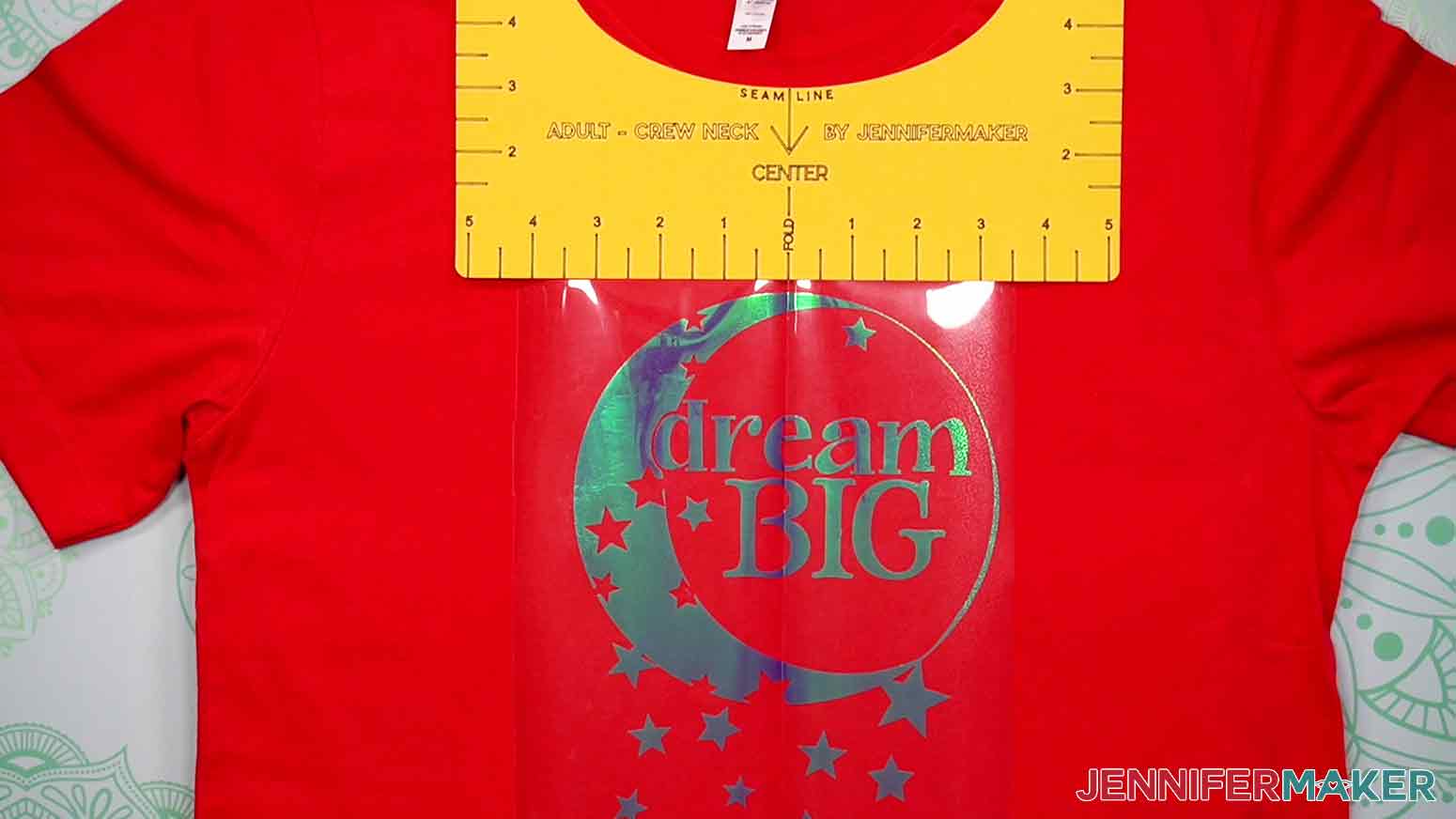 Place the Dream Big decal on the t-shirt and use the center fold of the decal, and the center fold of the t-shirt, along with the T-Shirt-Ruler to achieve the proper decal placement.