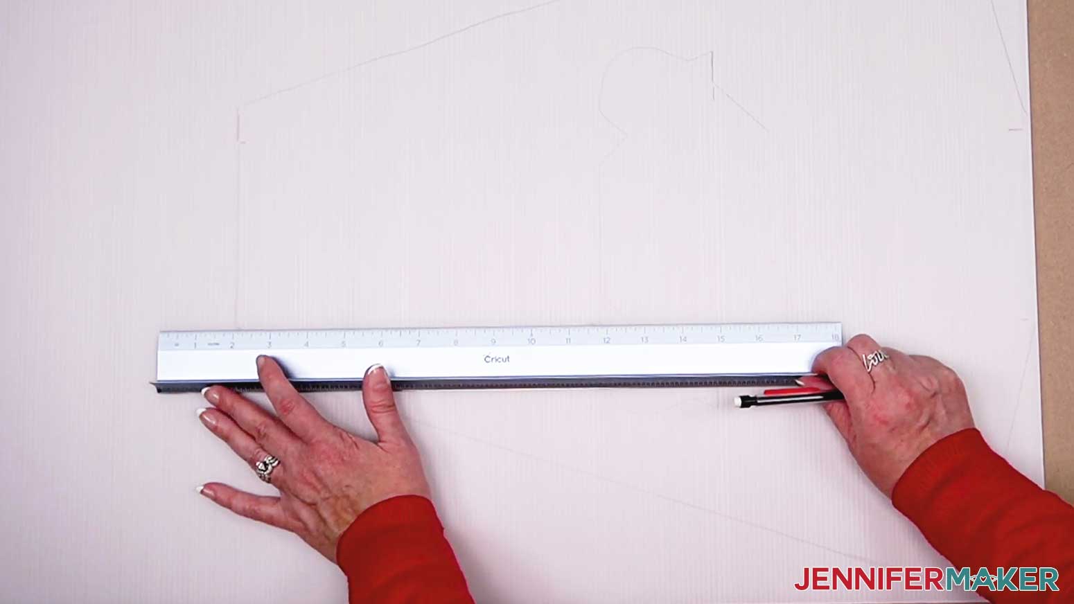 Tracing the score lines onto the stand template to be used for your DIY Cut Out Character.