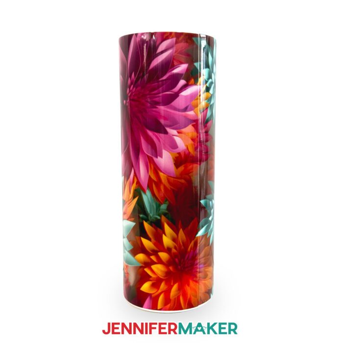A skinny tumbler with a 3D floral sublimation design featuring fuchsia and orange blooms.