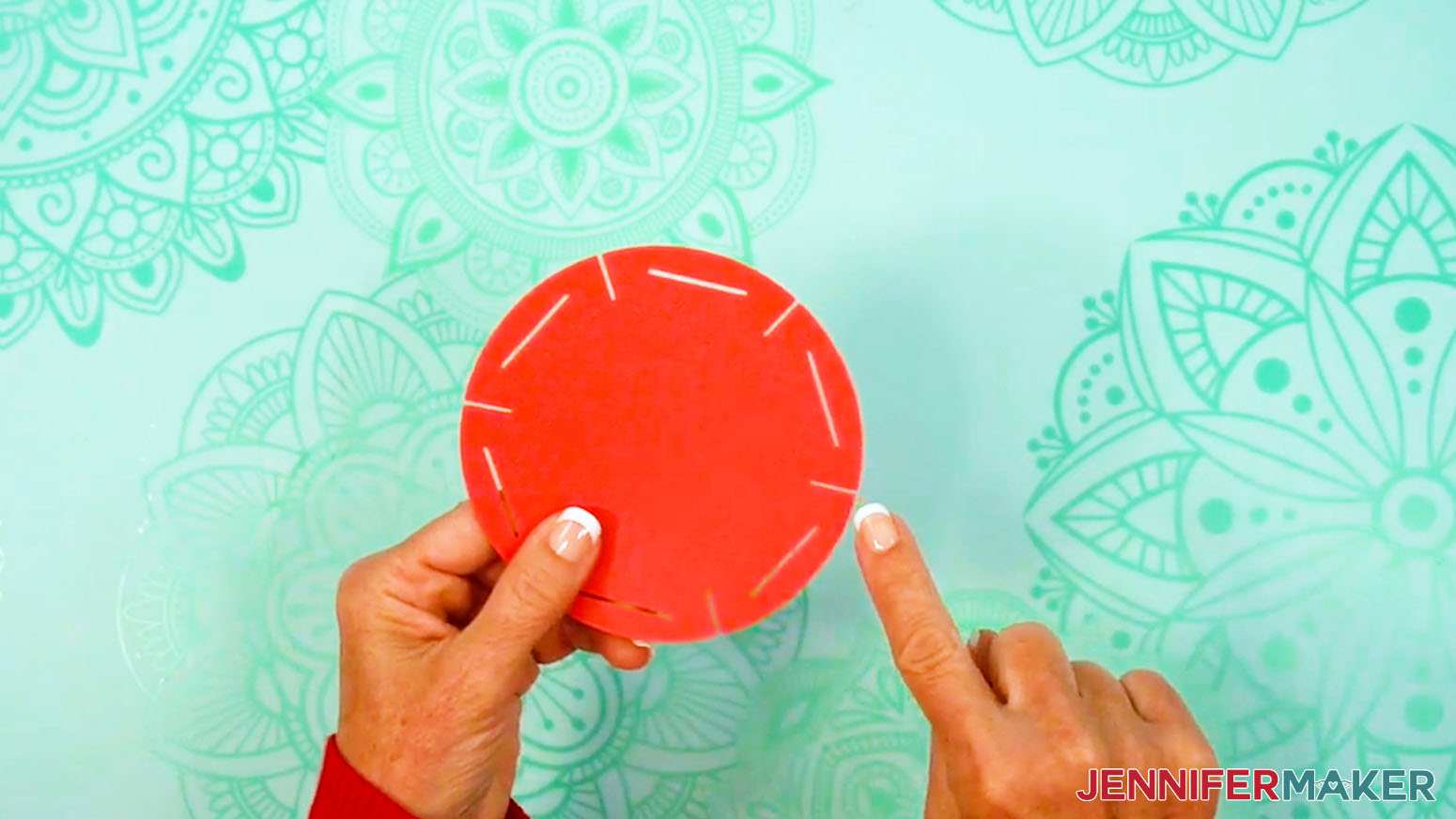 The 3D ornate paper lantern's circular top base piece has six outer slits for inserting into the lantern frames.