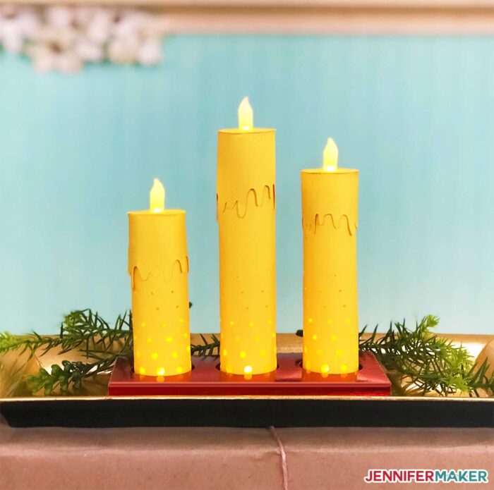 A 3d paper candle centerpiece for a holiday table made on a Cricut