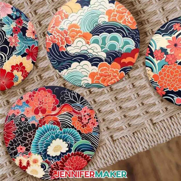 Get designs for 12 new Japanese art-inspired sublimation coasters in JenniferMaker's new blog! Four coasters sit on a woven surface.