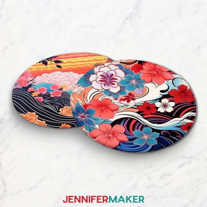 Get designs for 12 new Japanese art-inspired sublimation coasters in JenniferMaker's new blog! Two coasters sit on a white marble surface