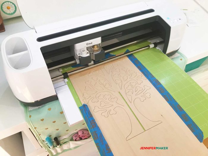 The Cricut Maker cutting out the basswood for the 3D family tree