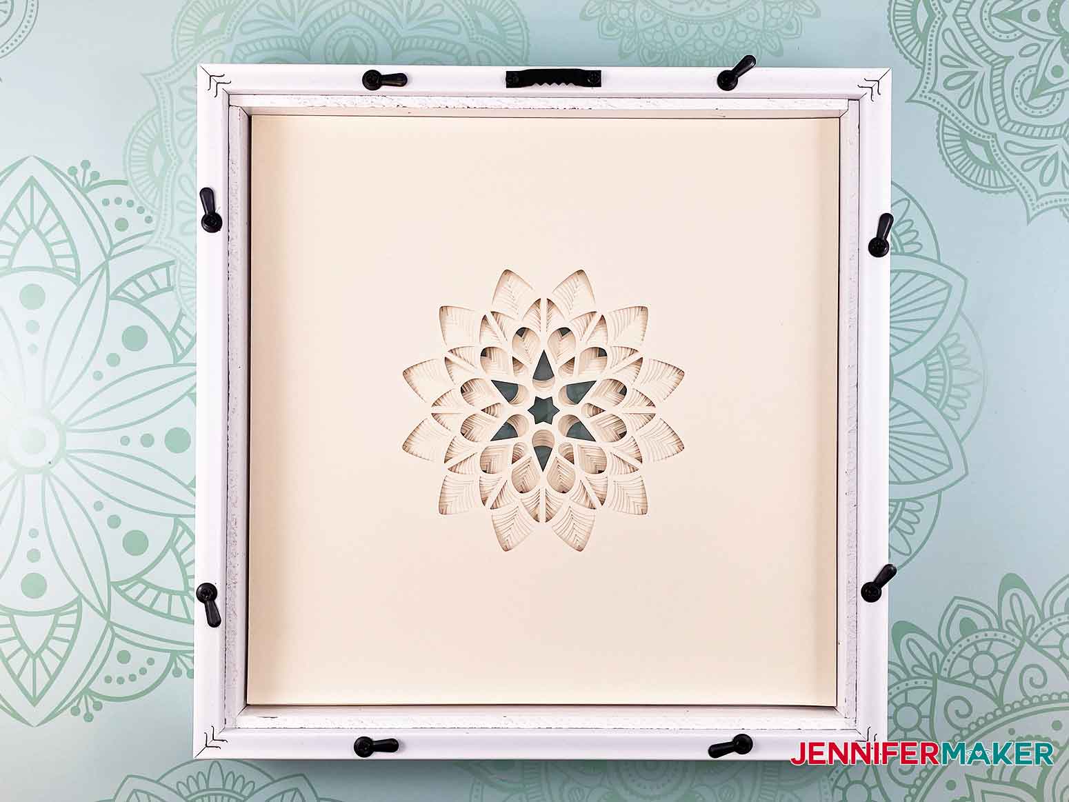 Insert your cut layers of cardstock into the frame for the 3D layered paper cut art flower