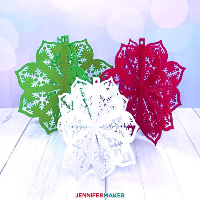Pretty 3D paper cut ornaments in green, red, and white. Make Cricut Christmas Ornaments with JenniferMaker's tutorial!