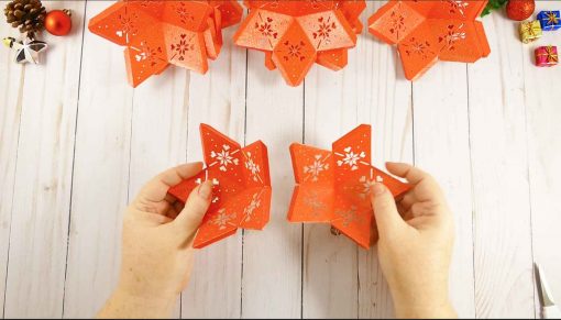 Attach two stars together to begin your 3D paper star