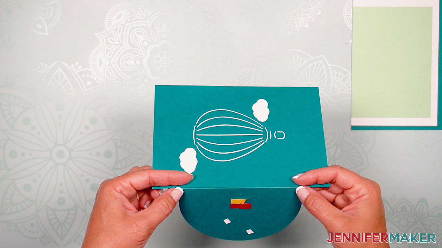 Image showing to glue the card front to the sky base piece of the birthday card pop up.