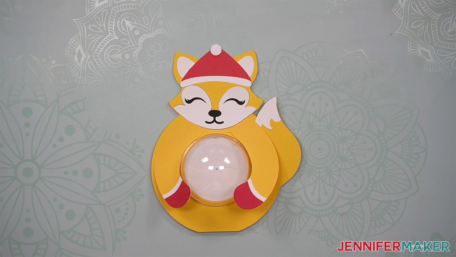 Image showing placement of hat on the fox candy holder.