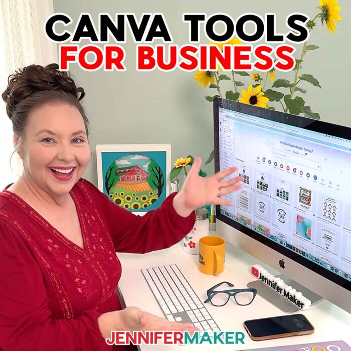 Jennifer sits at her computer wearing a red dress and smiling, working on a project in Canva. Learn her 10 Best Canva Tools for Business in the blog post!