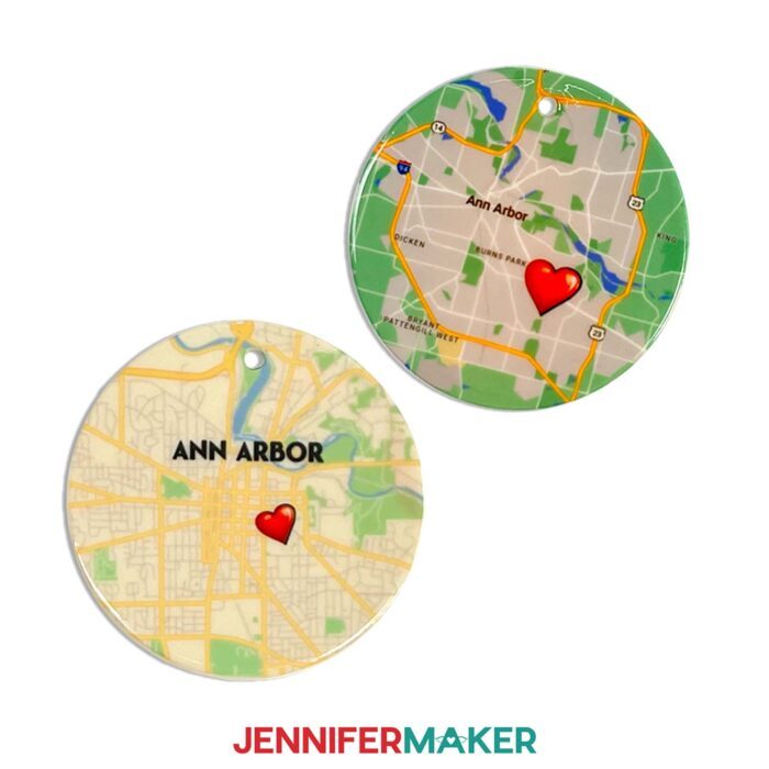 Make a custom ceramic tile map with sublimation with Jennifer Maker's tutorial! Image description: Two ceramic tile maps sit on a white surface. Maps are of Ann Arbor, Michigan, and feature cute heart icons you can add in Cricut Design Space.