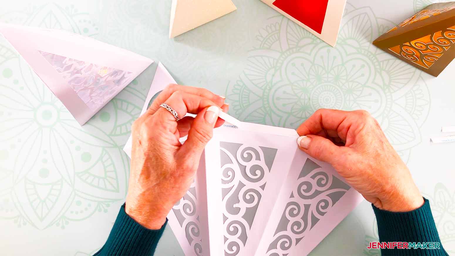 remove the paper backing off the tape on the flaps for my Christmas Tree Luminary