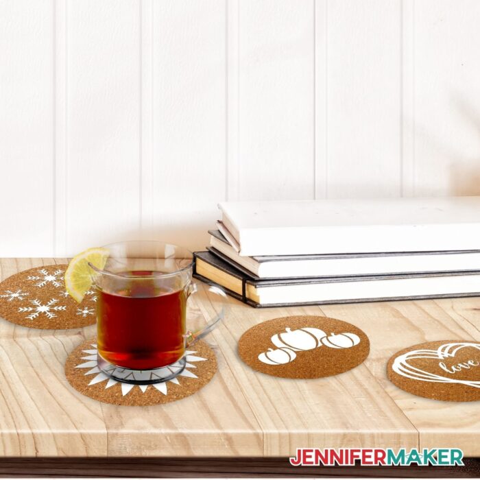 Custom Cork Coasters with a red drink on top and books beside them