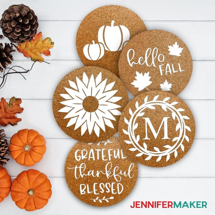 Custom Cork Coasters lying flat with pumpkins and acorns beside them