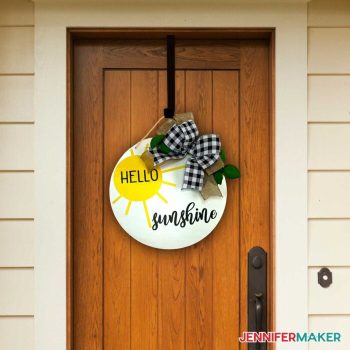 Hello round wood door hanger on a front door