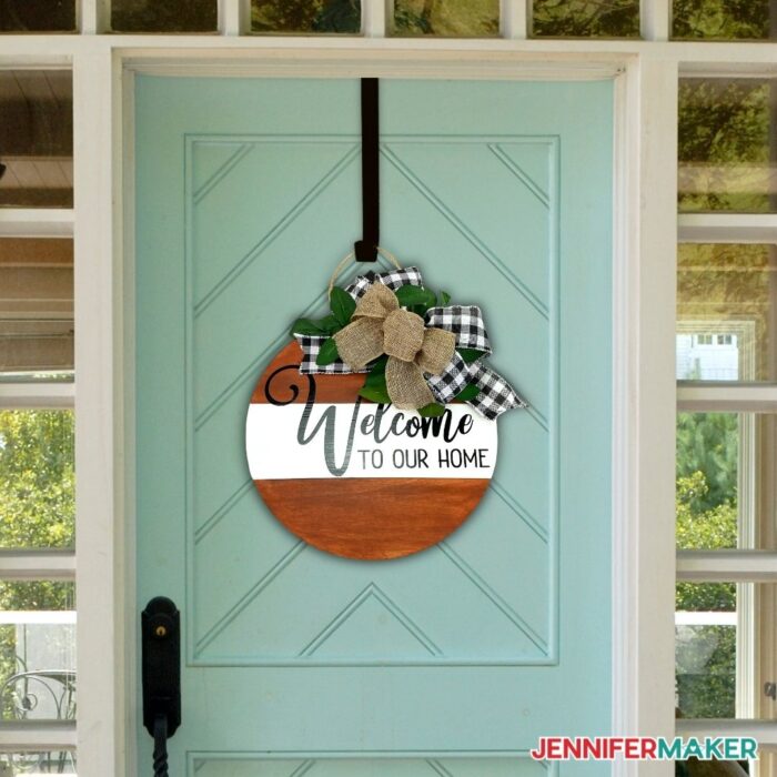 DIY Door Hanger with "Welcome to Our Home" on a blue front door