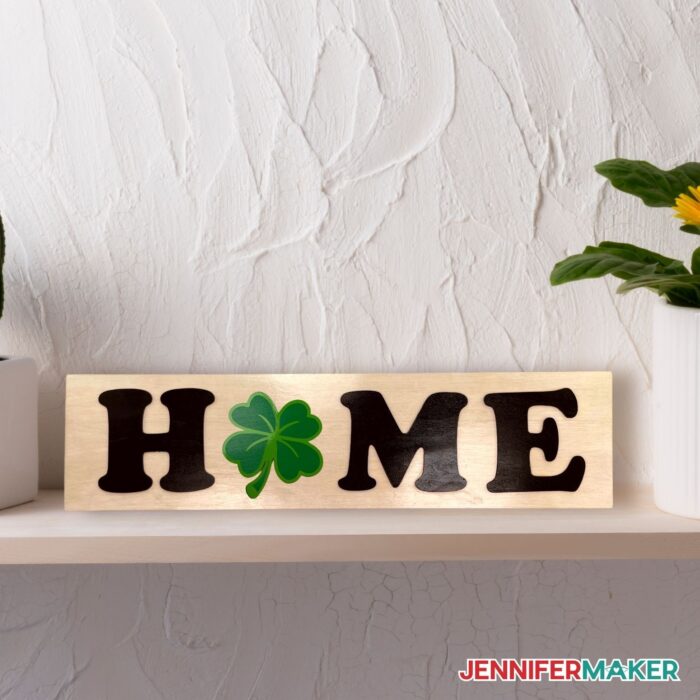 DIY interchangeable home sign with a four leaf clover in place of the "O"