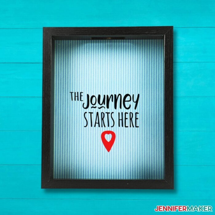 DIY Shadow Box with the words, "this journey starts here" on a blue background.