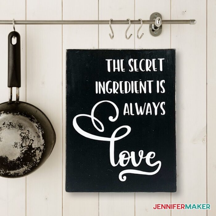 DIY Wood Block Sign with the words "The Secret Ingredient is Always Love"