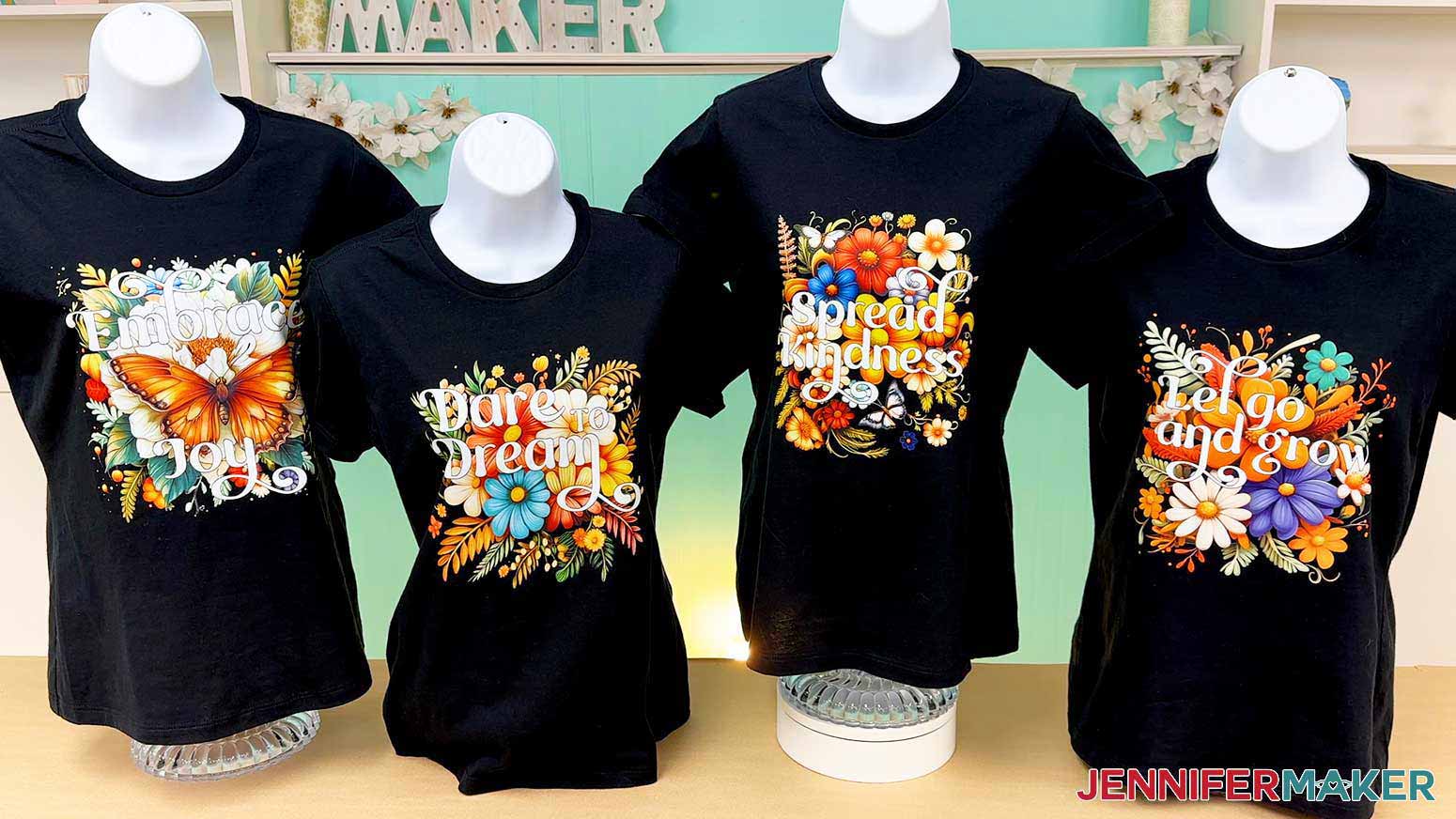 All four DTF designs are pressed on black shirts and ready to use.