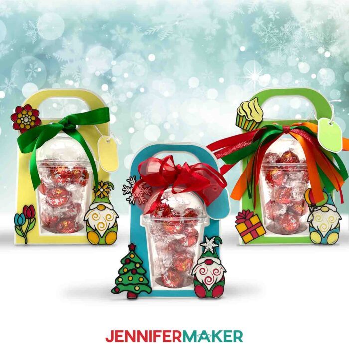 Make a dome cup holder with JenniferMaker's tutorial! Three holiday-themed domed cup holders sit against a snowy background.