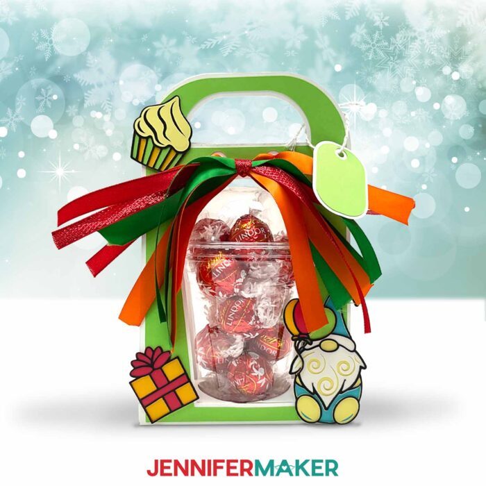 Make a dome cup holder with JenniferMaker's tutorial! A holiday-themed domed cup holder sits against a snowy background.