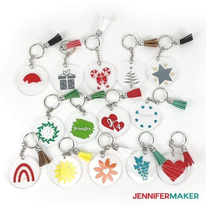 Acrylic Keychains with vinyl designs on them made using a Cricut cutting machine