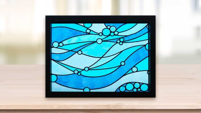 Faux stained glass window with blue waves made with Sharpie markers and vinyl lead lines on a Cricut