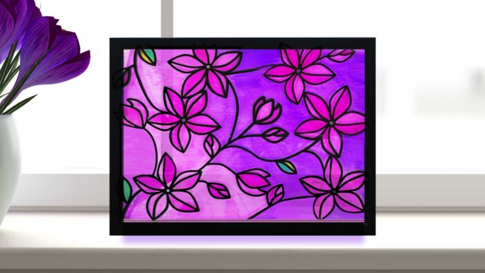 Faux stained glass window with flowers made with Sharpie markers and vinyl lead lines on a Cricut