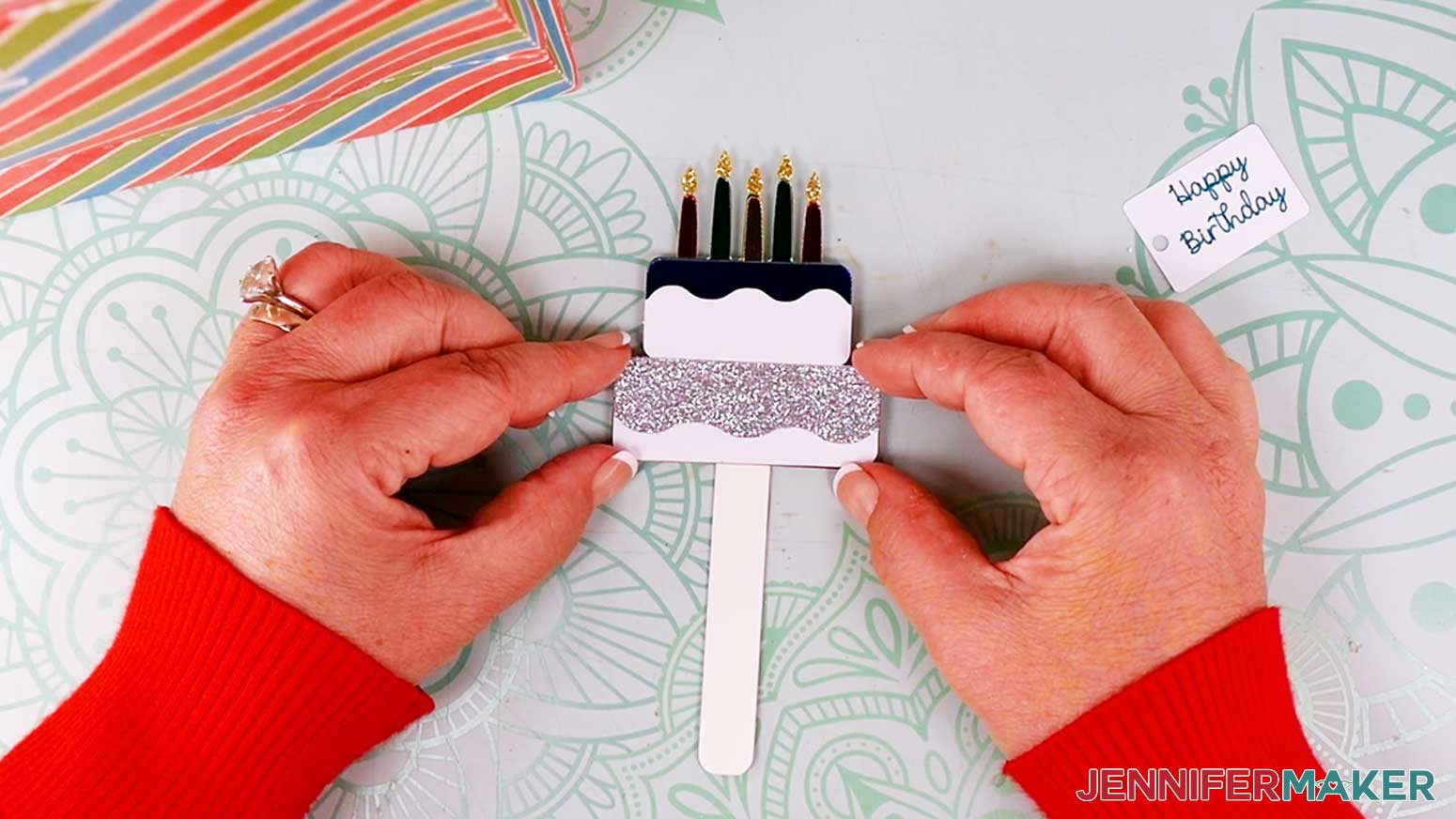 Attach the birthday cake to the pick with craft glue.