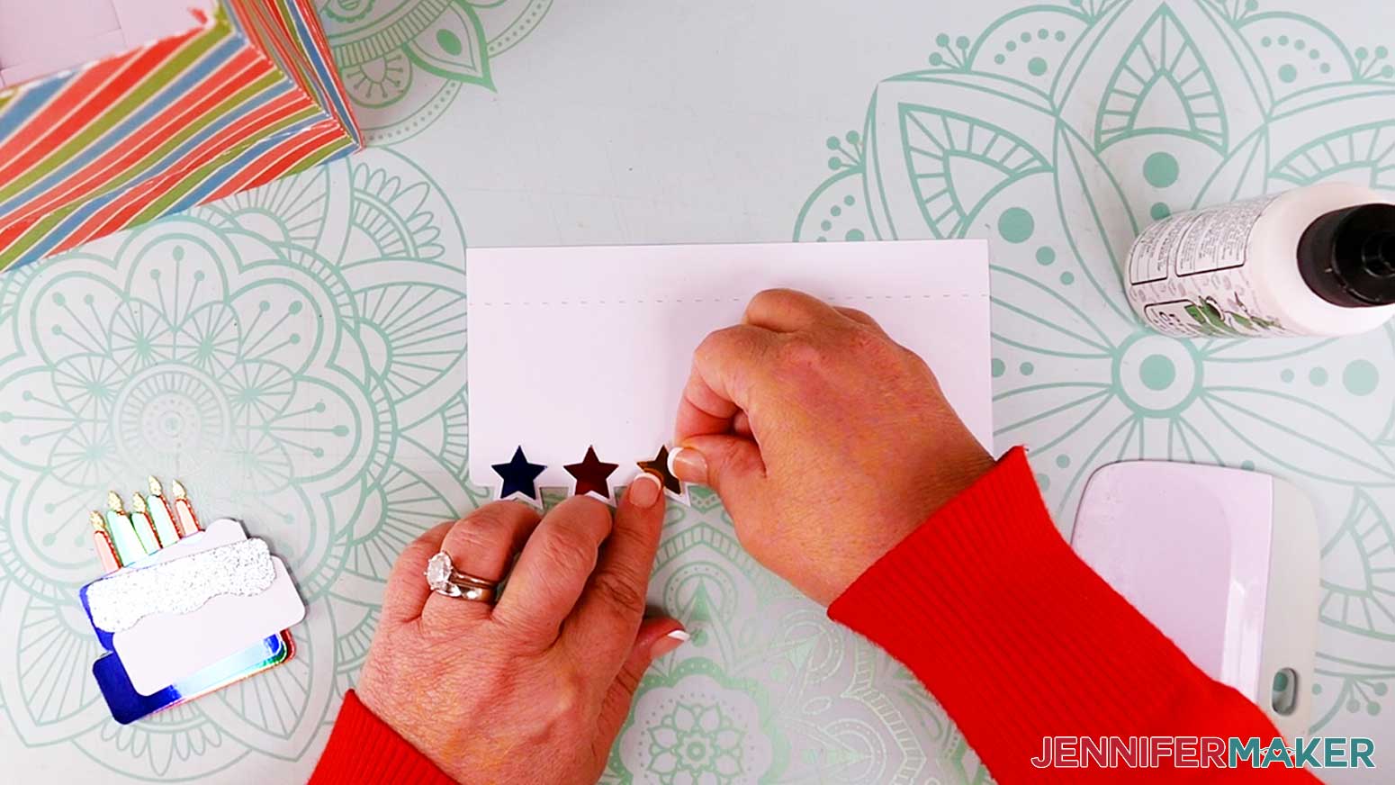 Use craft glue to attach the stars to the top-fold piece of the gift bag.