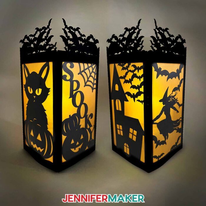 Halloween paper lanterns showing the four panels with a cat, pumpkins, "spooky" a haunted house, witch, and bats with orange vellum diffusing the light inside.